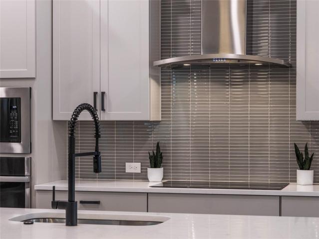 This kitchen is sophisticated and modern.