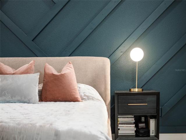 You'll love the modern wall detail and decor in the master retreat.