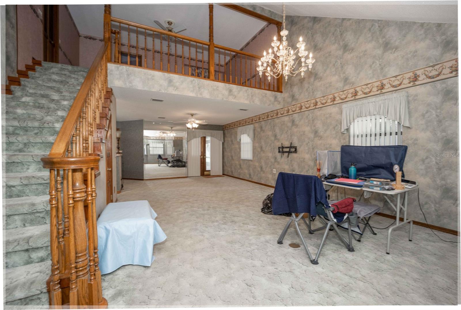 Living area w/ stairs view