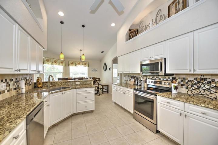 Granite countertops and travertine backsplash