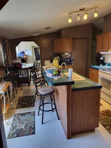 kitchen leads to dining and laundry room