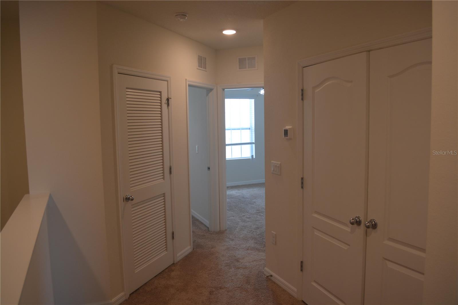 2nd floor view towards 2nd BR (laundry closet on right)