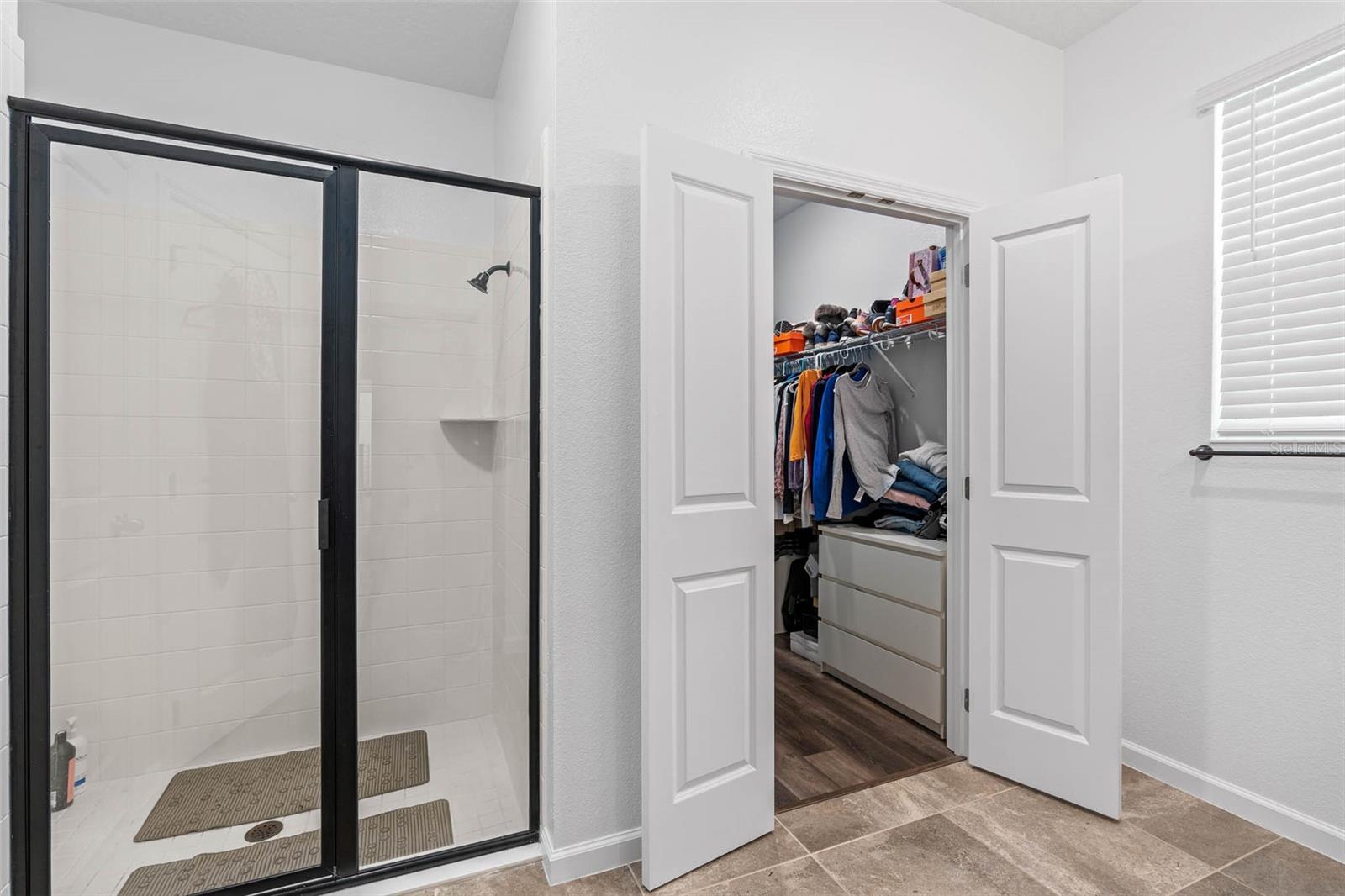 master bathroom shower and large walk in closet