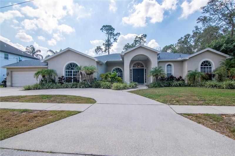 Large circular driveway and parking pad