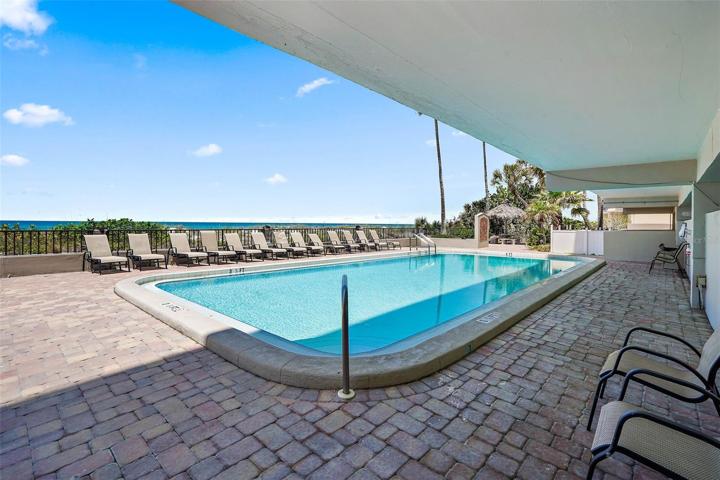 Private community pool with easy access to the beach!