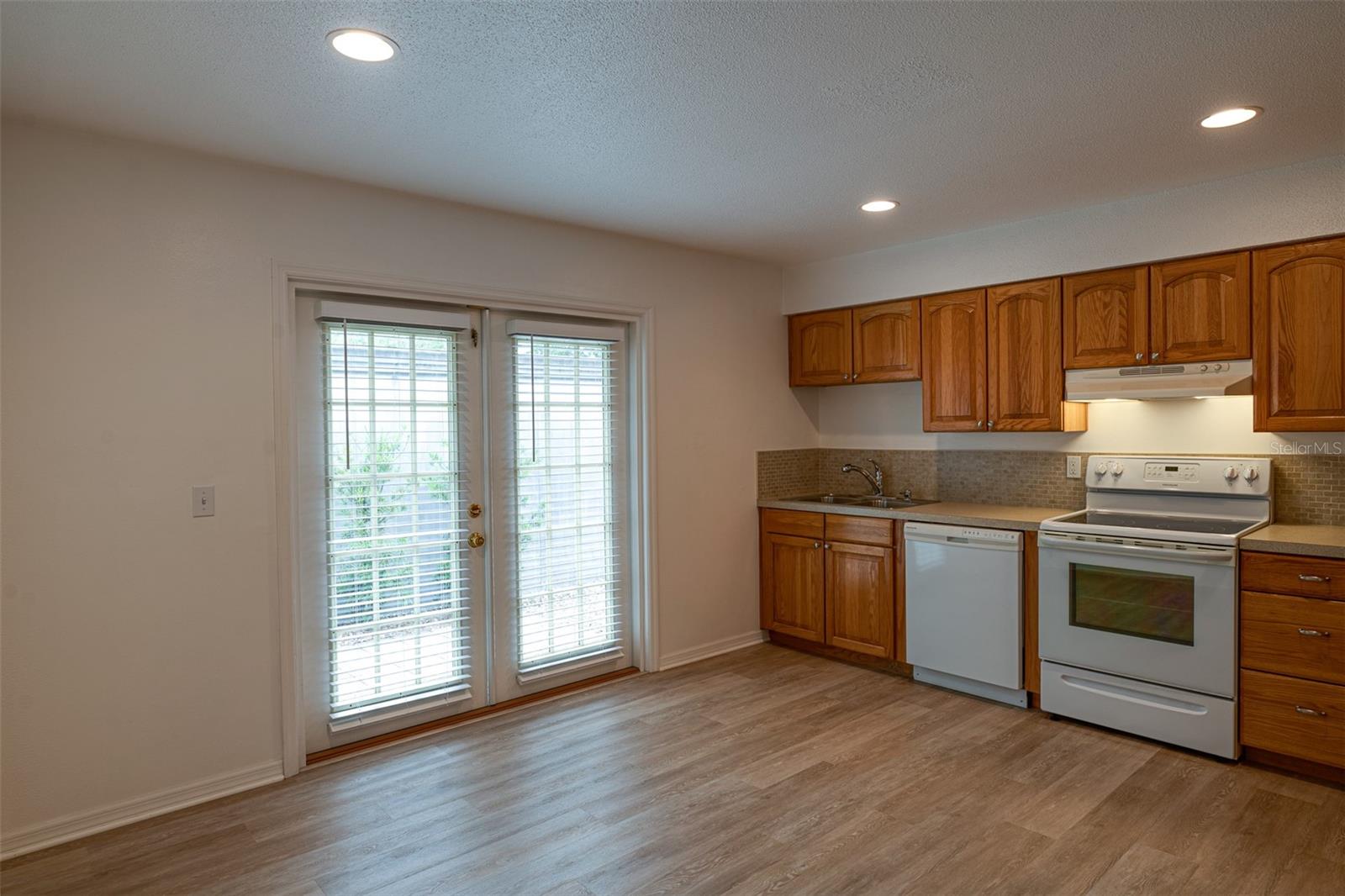 #A Kitchen with access to fenced patio