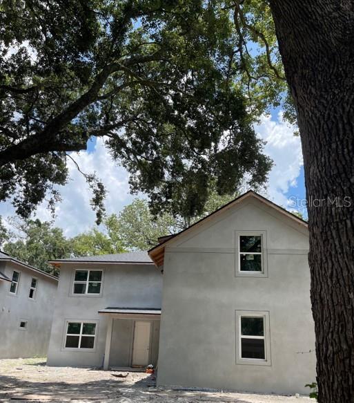 Mature Tress Frame House creating Great Curb Appeal.