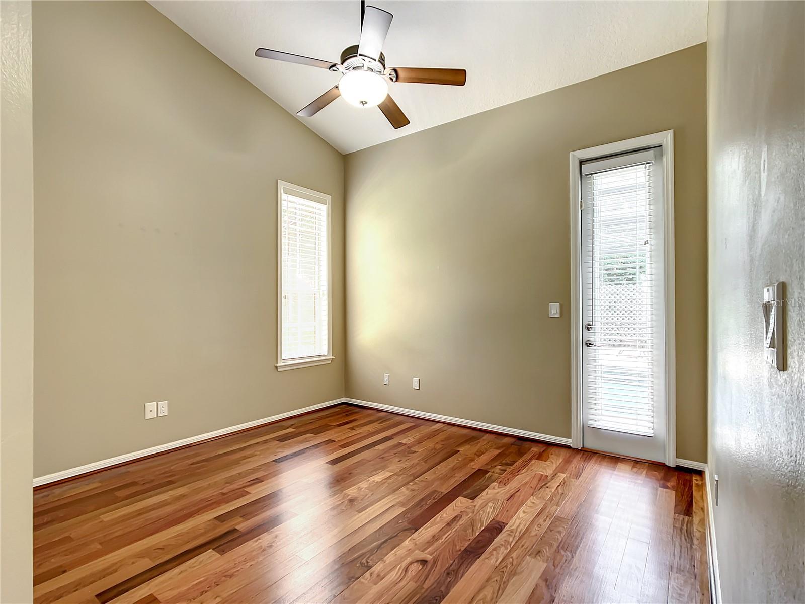 Bedroom 2 with exit to pool