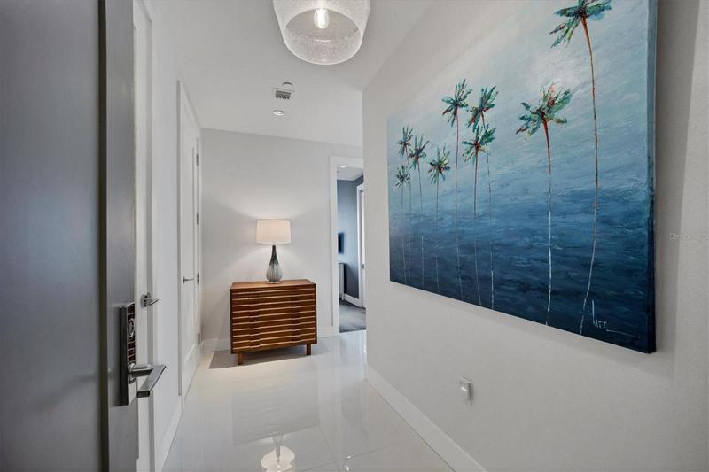 Enter to this corner unit with plentiful natural light and views beyond.