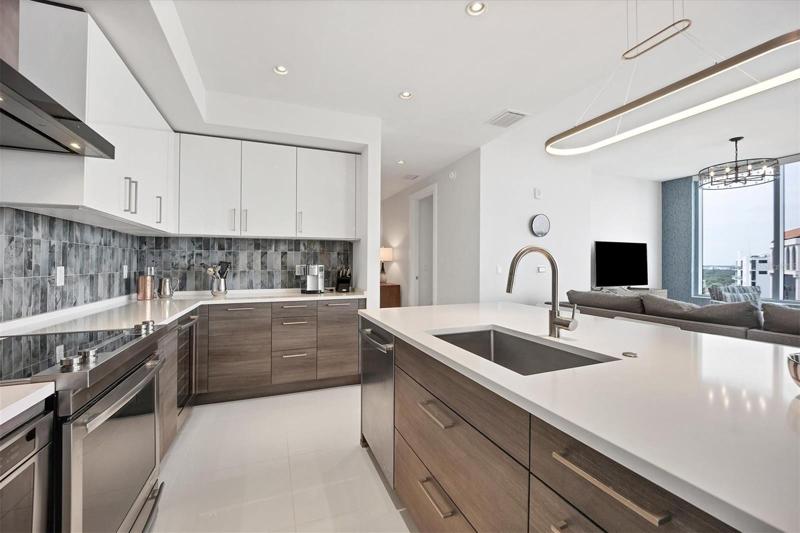 Stunning modern kitchen with center island and plenty of storage and counter space.