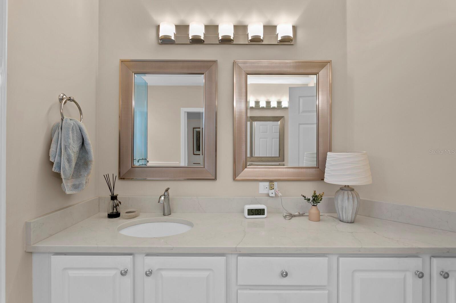 Two separate vanities are a nice feature in the primary bath.