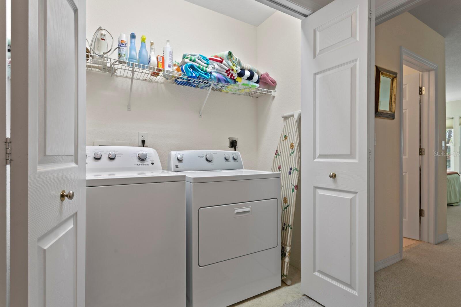 The laundry closet is convenient to the bedrooms.