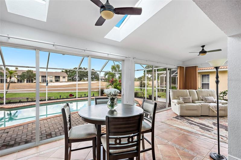 sunroom, overlooking pool and golf course