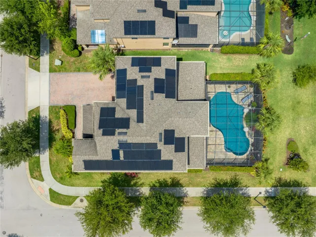Aerial view of house roof, pool & backyard