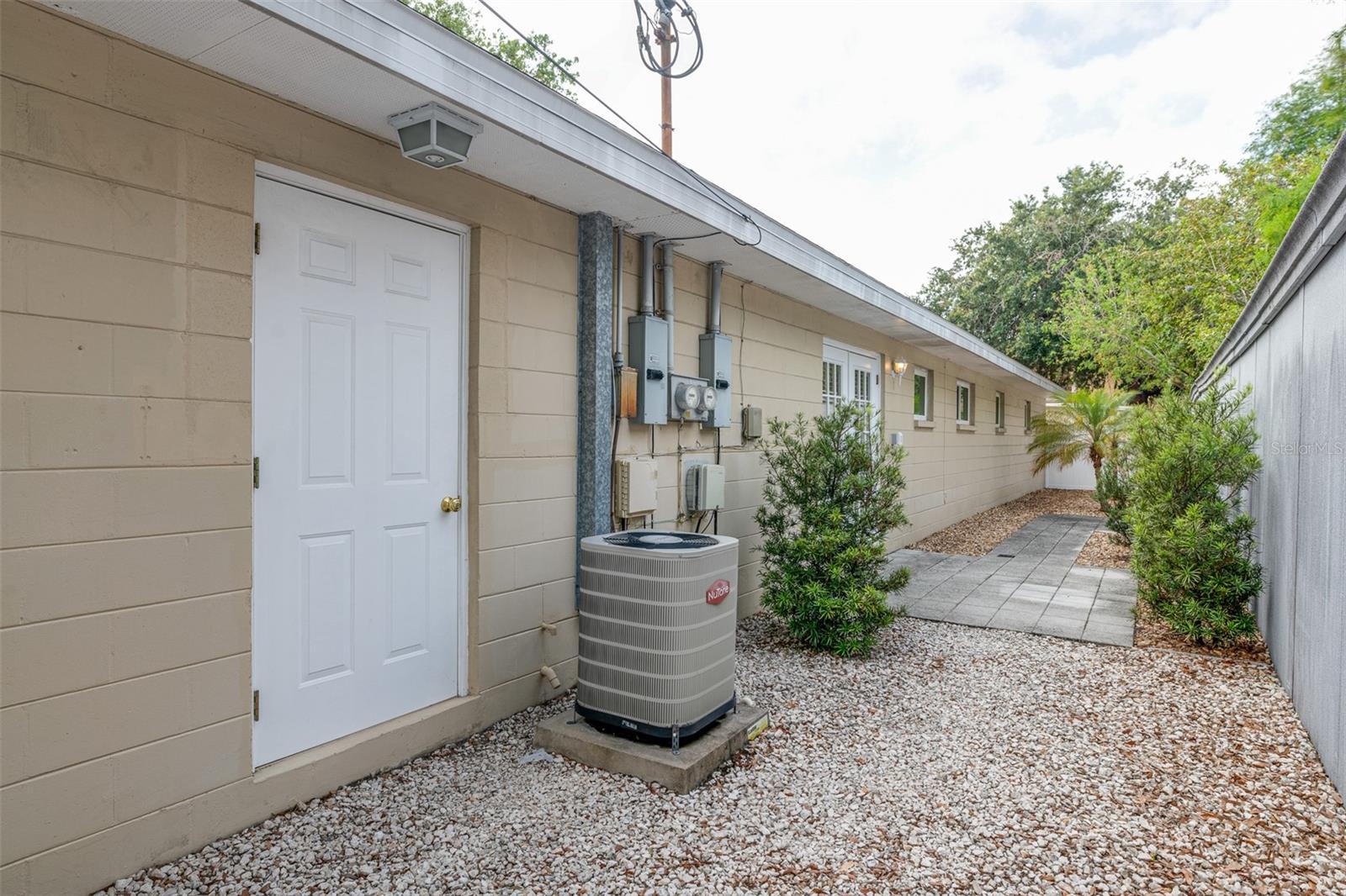 #A Side yard with laundry & garage & owner storage access