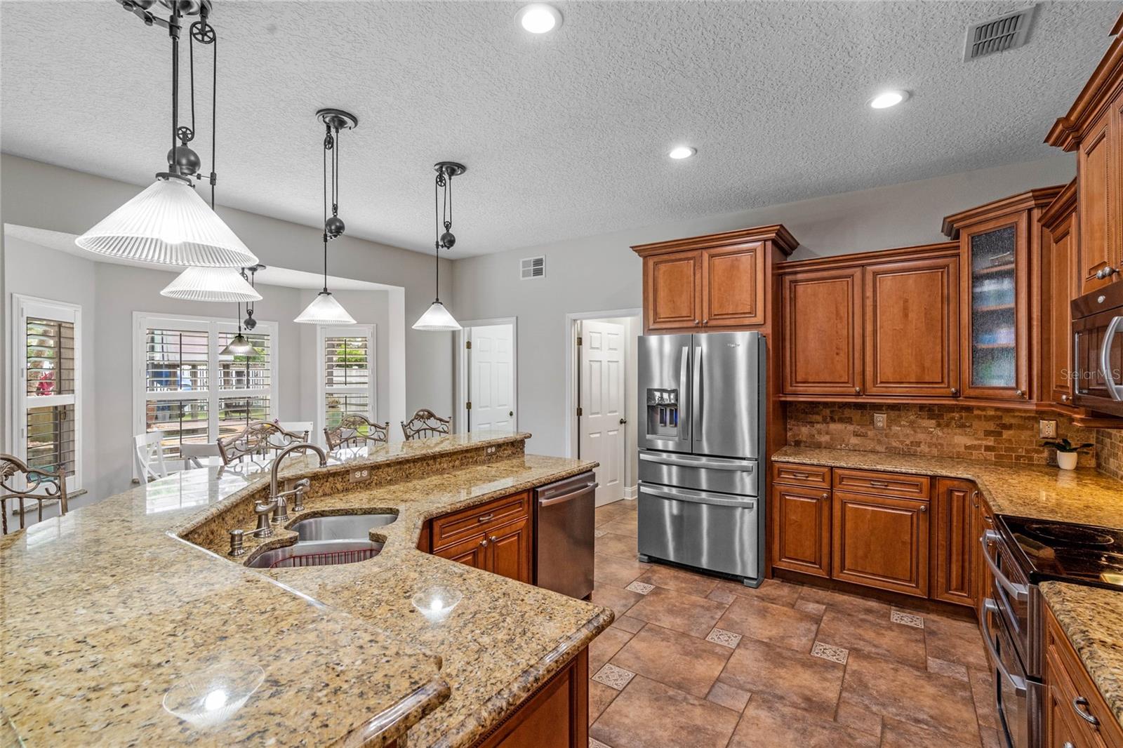 Kitchen/Breakfast Nook/Entry Way to1st Level 1/2 Bathroom and Laundry Room