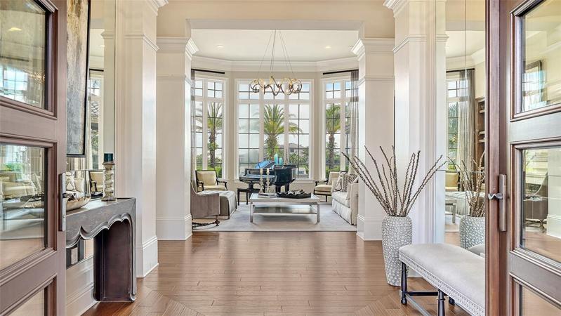 enter through front doors into luxury living
