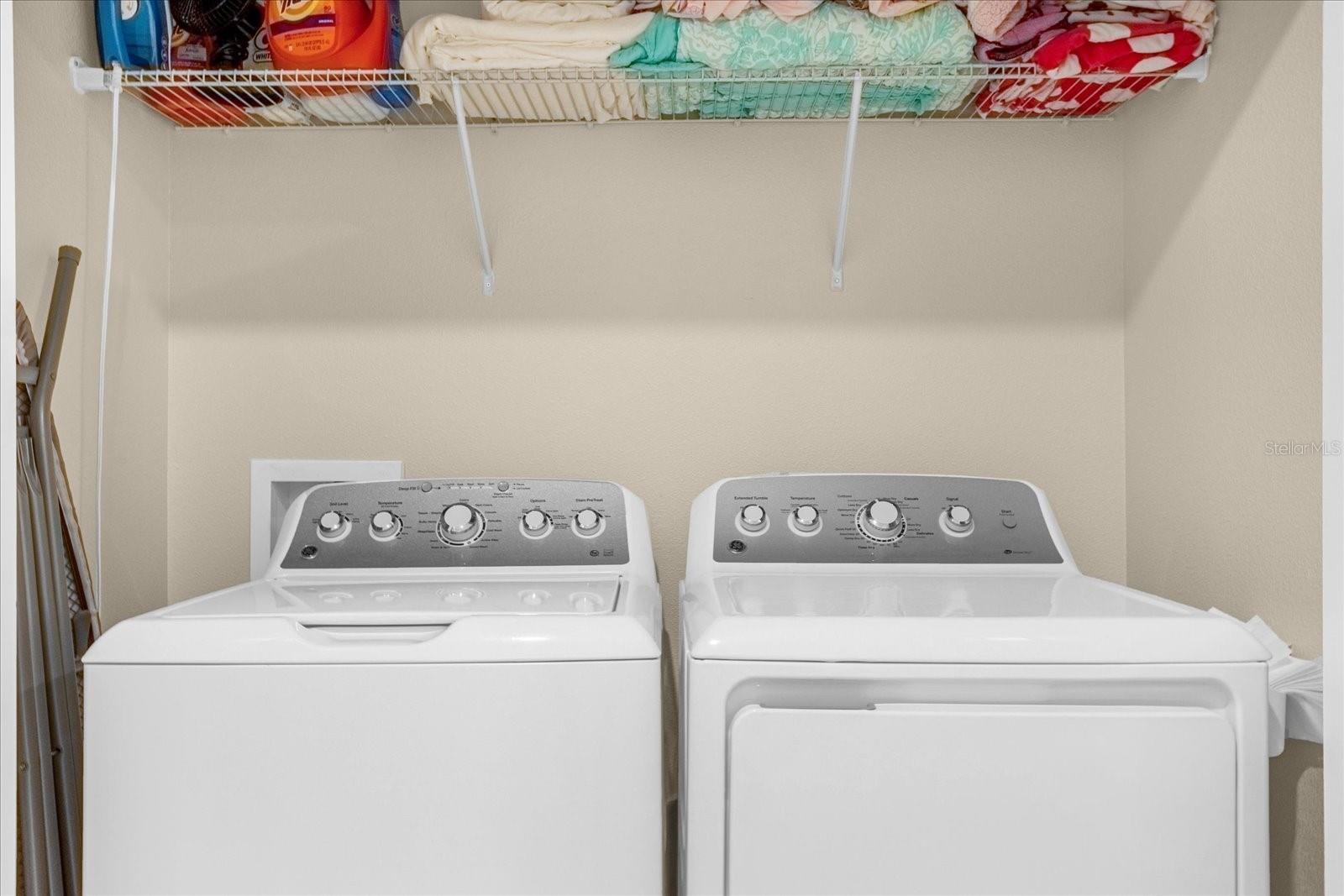 Upstairs laundry room between bedrooms.