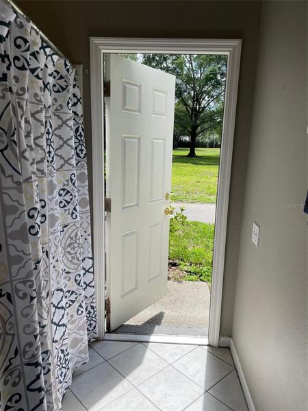 Downstairs Bathroom and Door to East Side of Property