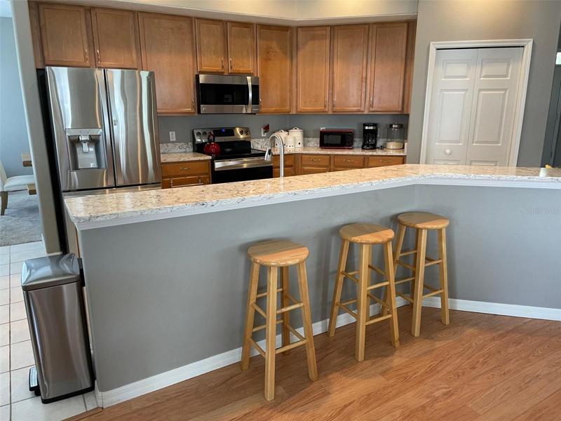 Breakfast Bar w/ Kitchen in Background