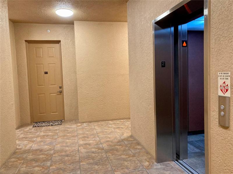Elevator, hallway and front door