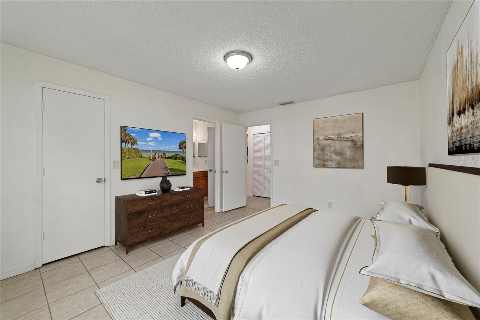 SPLIT BEDROOMS deliver two en-suite bedrooms both with generous closet space and windows that let the natural light pour in! Virtually Staged.