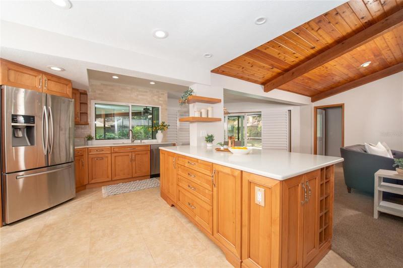 Pass through window, makes it easy for entertaining!  Kitchen is functionable and opened!