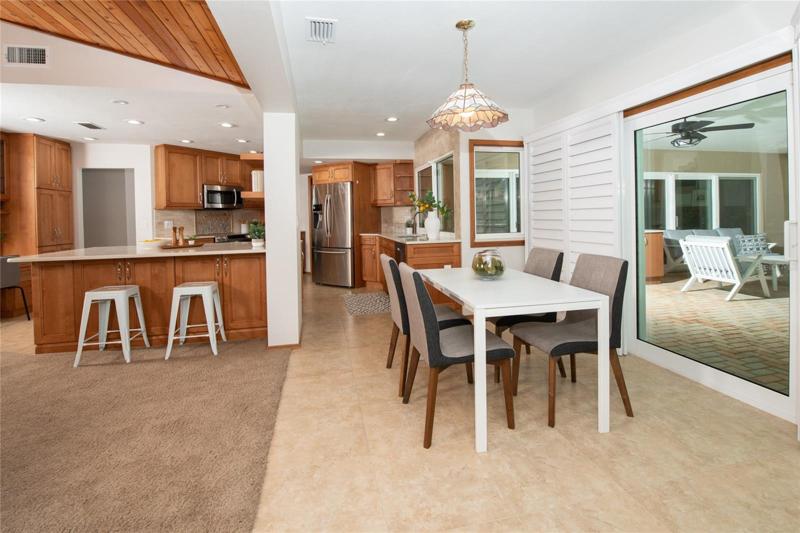 Wood Shutters! Breakfast dining area opens to the family room, kitchen and the outside!