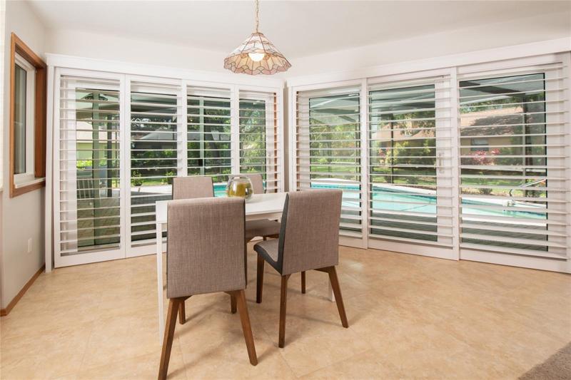 Breakfast dining area opens to the lanai and pool