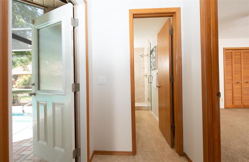 Pocket doors makes this perfect for a blended family. 3 rd Bathroom and 4th bedroom plus door to the pool!