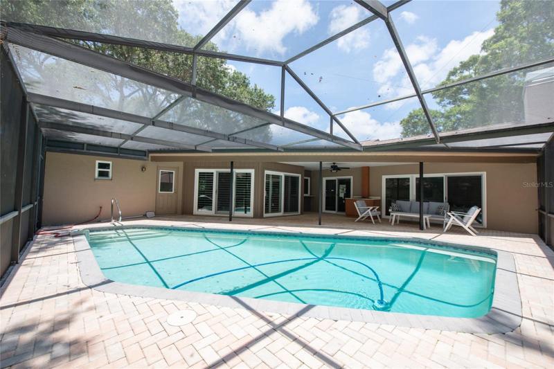 Salt water pool, with solar heat pump ! This home opens to the pool area. Notice the door leads to the 3rd bathroom!