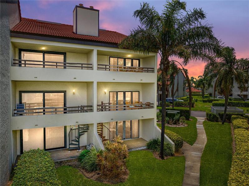There are two balconies facing the water and a patio. Unit #101 is the unit to the right.