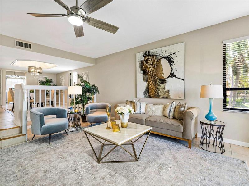 The living room is two steps down from the dining area.