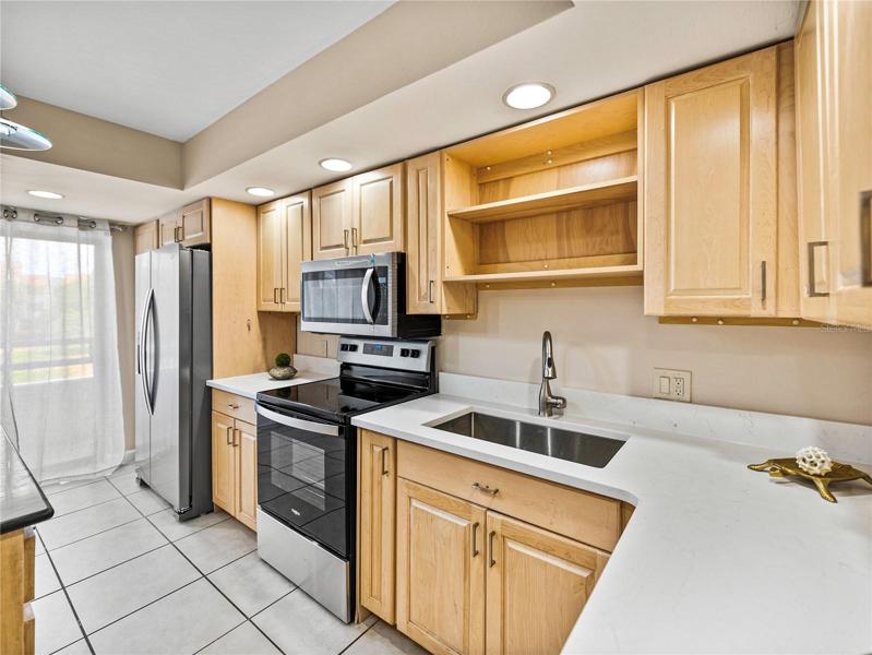 The kitchen has a brand new quartz countertop, undermount sink and faucet.