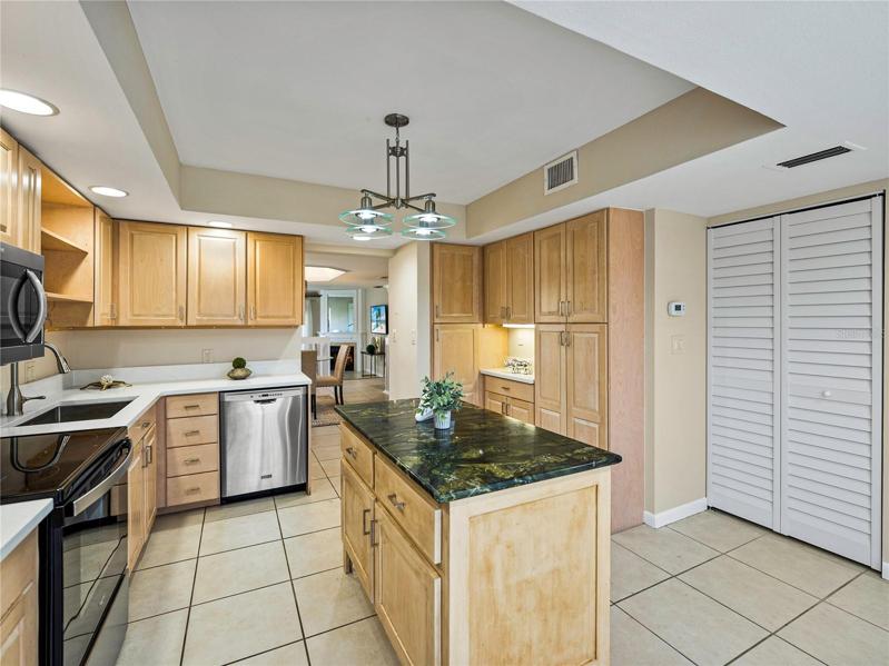 Throughout the home, new plantation style bifold doors were installed, as seen here in the kitchen.