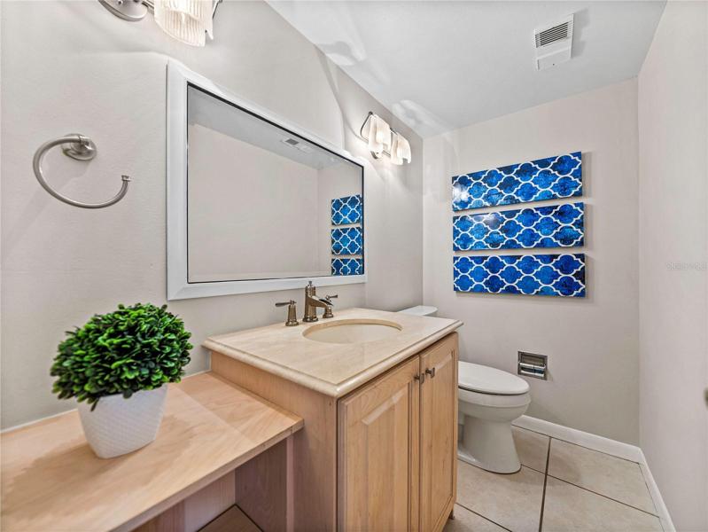 The half-bath is conveniently located on the main floor of living, which is the second floor of the townhouse.