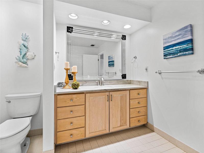 The designer mirror adds an elegant touch.