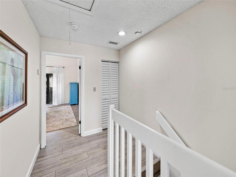 Looking from the Guest end of the third floor hallway toward the primary bedroom.