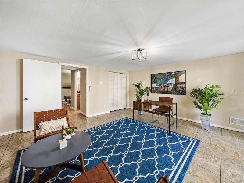 The room has a storage closet and like all of this downstairs area has tile flooring.