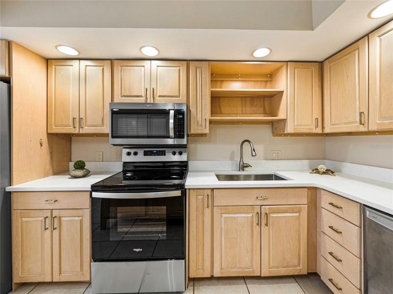 There is room above the sink for cookbooks, glassware... whatever tickles your fancy!