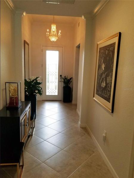 Chandelier with it's sparkle and shimmer in entry is negotiable
