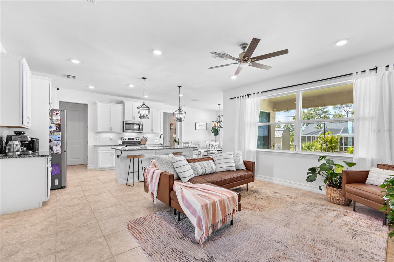 Open Floor Plan Natural lighting with large double paned, energy effecient windows.  18"X18" ceramic tile.  Cortz countertops.  Stainless steel appliances.