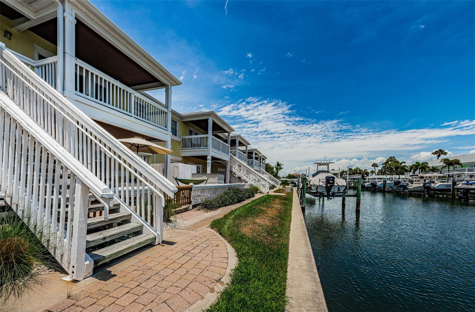 Walk down your stairs from patio.....just a few ft from water