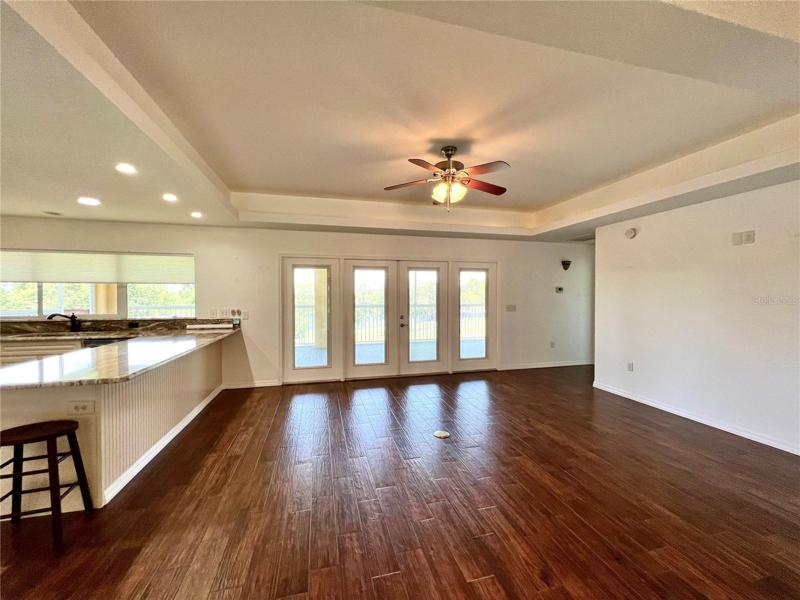 2nd home- great rm w/ French doors leading to scr patio