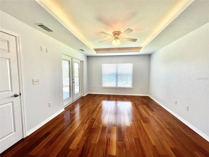 2nd home master suite w/ doors leading to scr patio