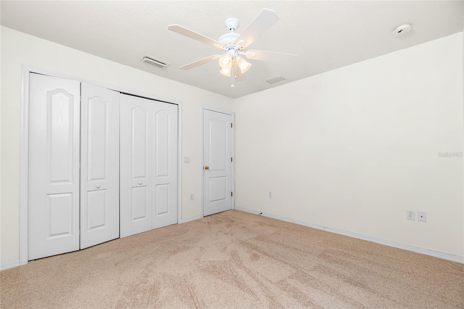 Guest Bedroom #3 has a ceiling fan and wall closet
