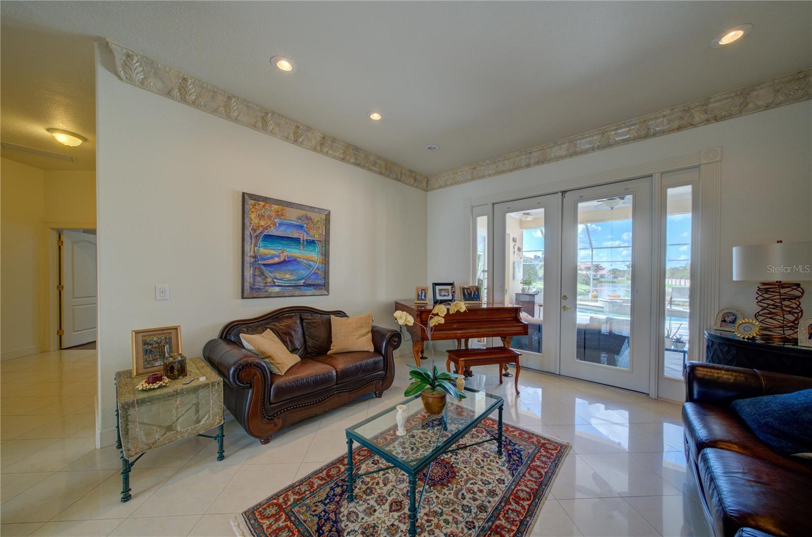 Formal living room with access to the pool