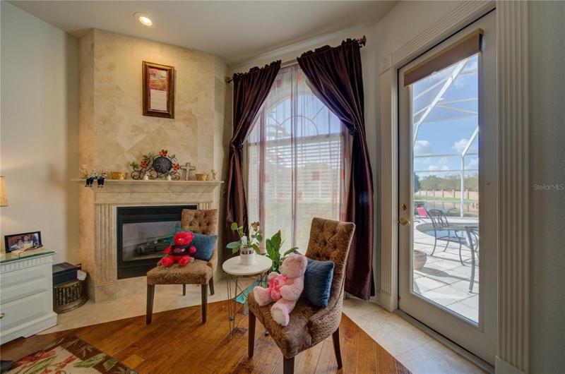 Fireplace in the Primary Bedroom with pool access