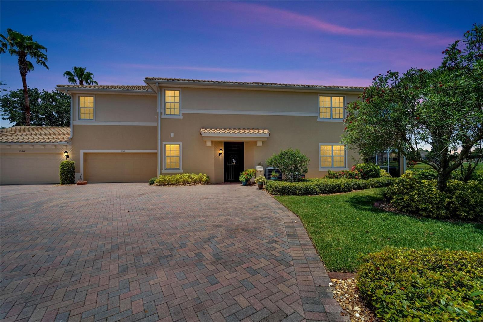 Front entrance view of the home and garage showing the tranquility of the condo.