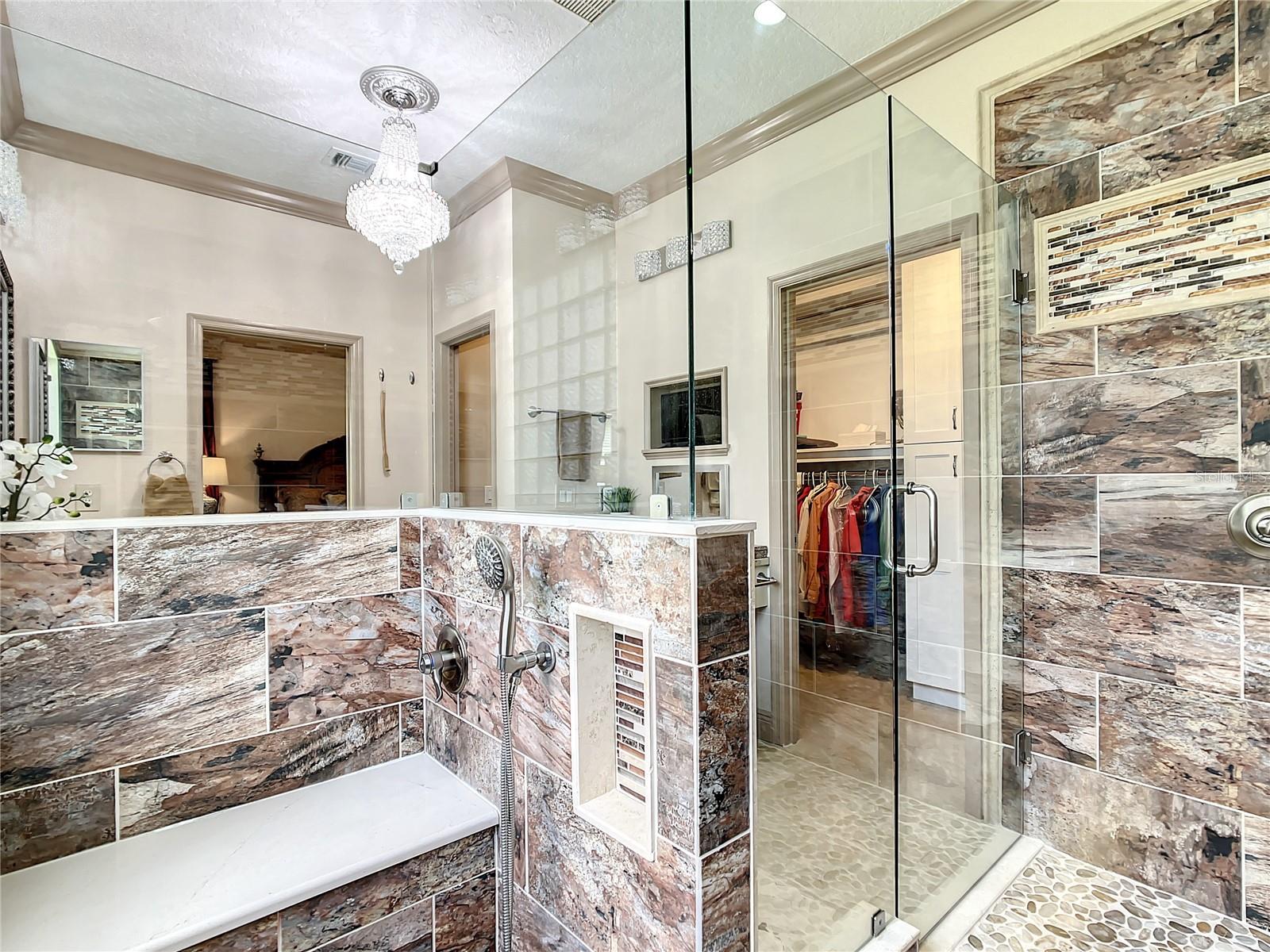 SEATING AREA IN SHOWER WITH ADDITIONAL SHOWERHEAD
